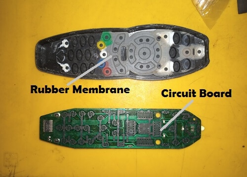 Open dstv remote control showing rubber membrane and circuit board